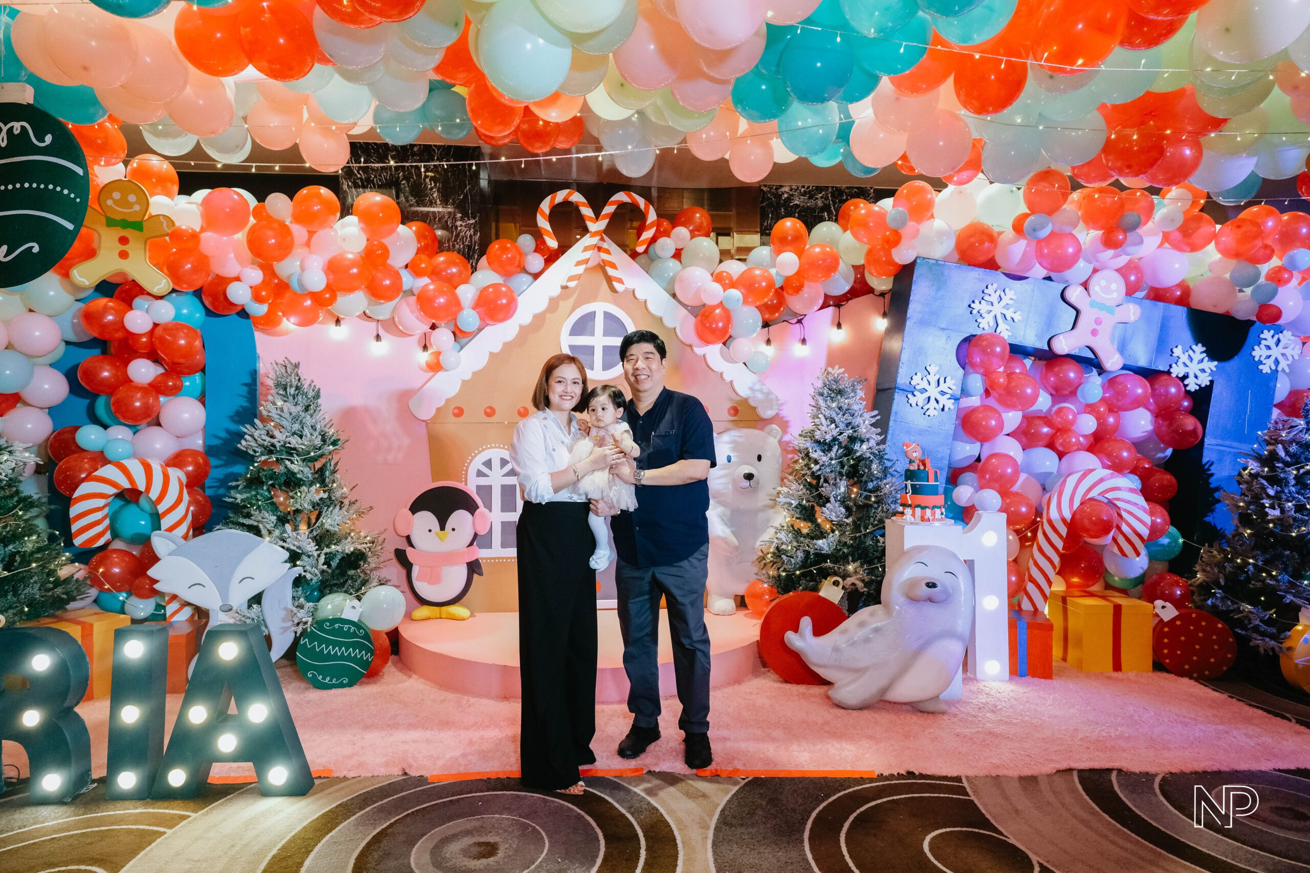 Christmas themed kids' party decor with colorful decorations, festive lights, and playful holiday elements. Expert event styling in Metro Manila, Philippines, featuring Christmas trees, Santa Claus, reindeer, and fun holiday-themed activities. Perfect for children's birthday parties, family gatherings, and festive kids' events.