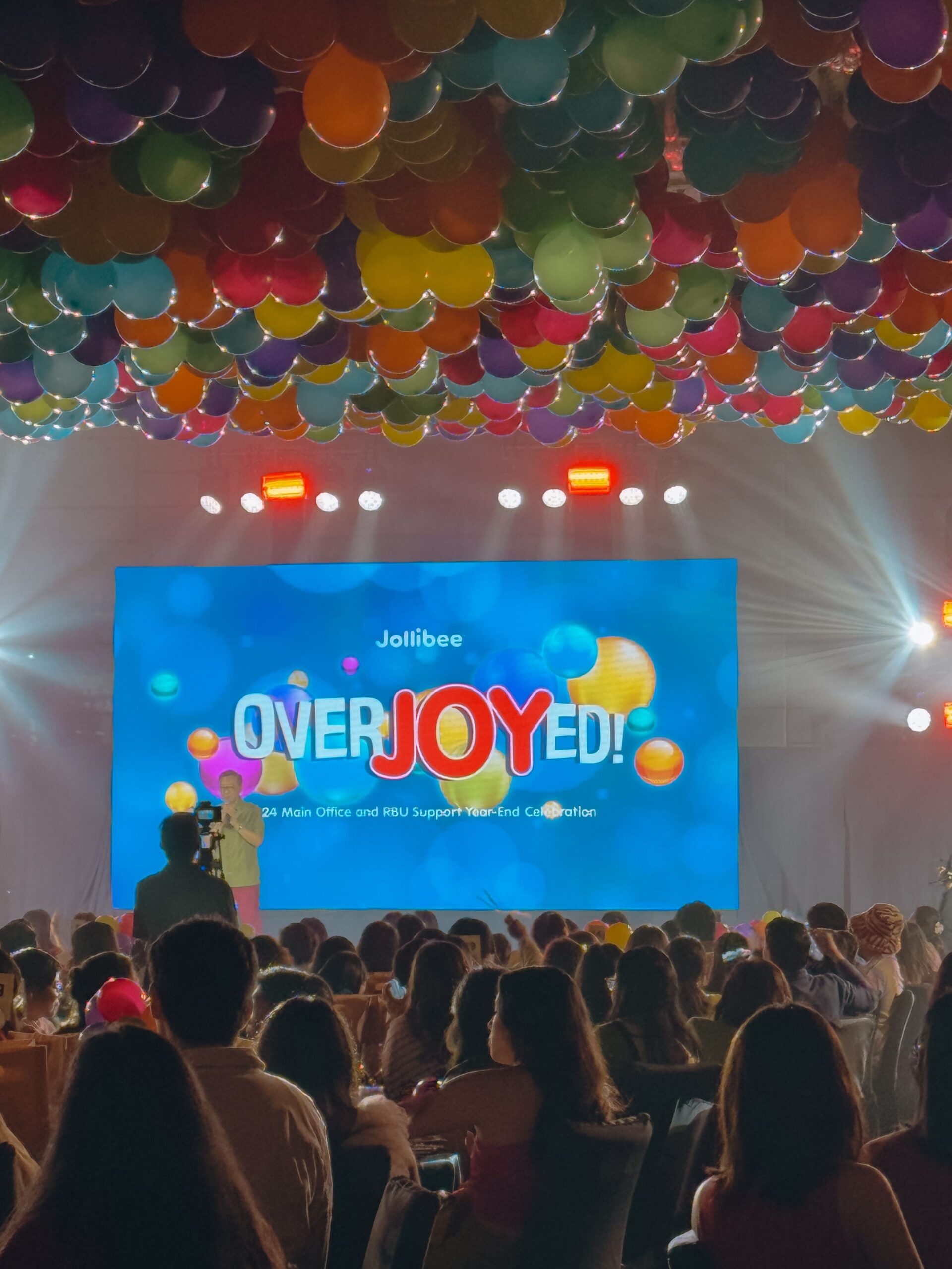 Corporate event styling by professional event stylist for Jollibee – elegant stage design, branded corporate setup, balloon arrangements and custom decor, trusted event coordinator for company events in Metro Manila