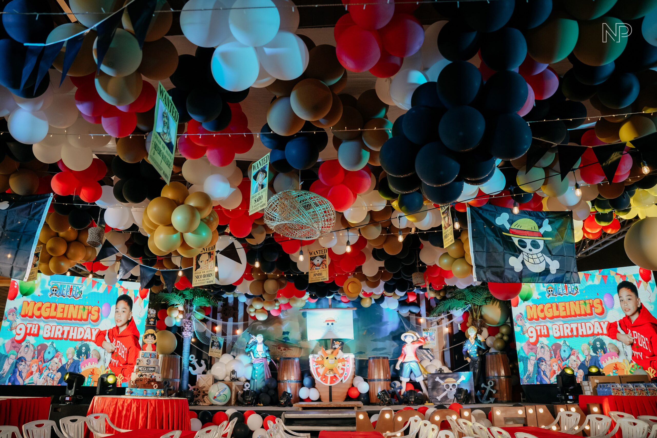 One Piece themed party decor featuring pirate ship backdrops, anime character cutouts, and nautical-inspired styling. Expert event stylist in Metro Manila, Philippines, specializing in anime-themed parties, custom birthday setups, and creative event styling for kids and teens. Perfect for One Piece fans, children’s parties, and anime-inspired celebrations.