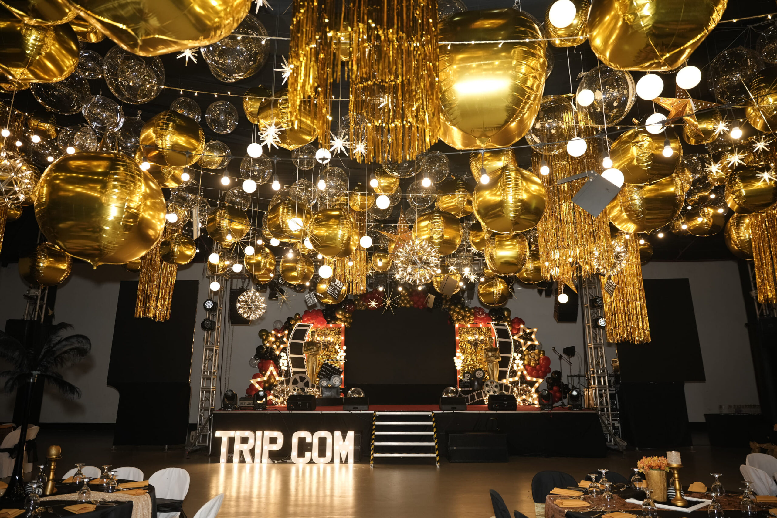 Corporate event styling for Trip.com with elegant decor, professional event coordination, and modern theme designs. Expert event planner for corporate conferences, company celebrations, and business functions. Stylish corporate event setup with branding, lighting, and unique themes.