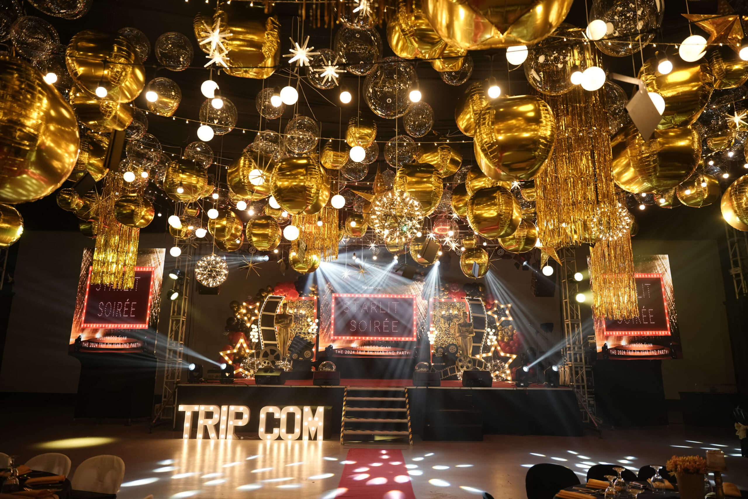Corporate event styling for Trip.com with elegant decor, professional event coordination, and modern theme designs. Expert event planner for corporate conferences, company celebrations, and business functions. Stylish corporate event setup with branding, lighting, and unique themes.