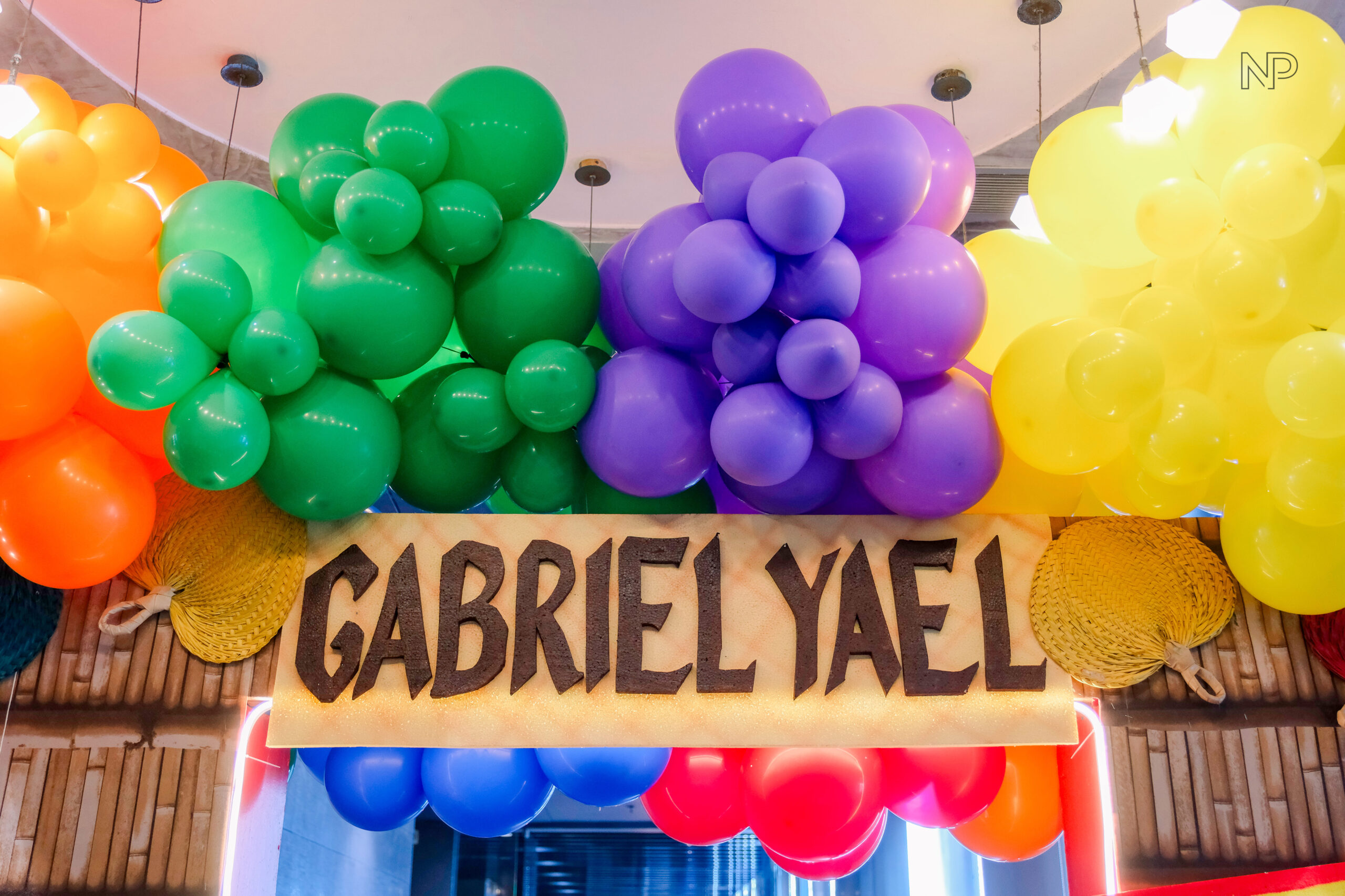 Creative Filipino-themed kiddie party setup featuring bamboo decorations, abaca accents, and colorful Filipino motifs"