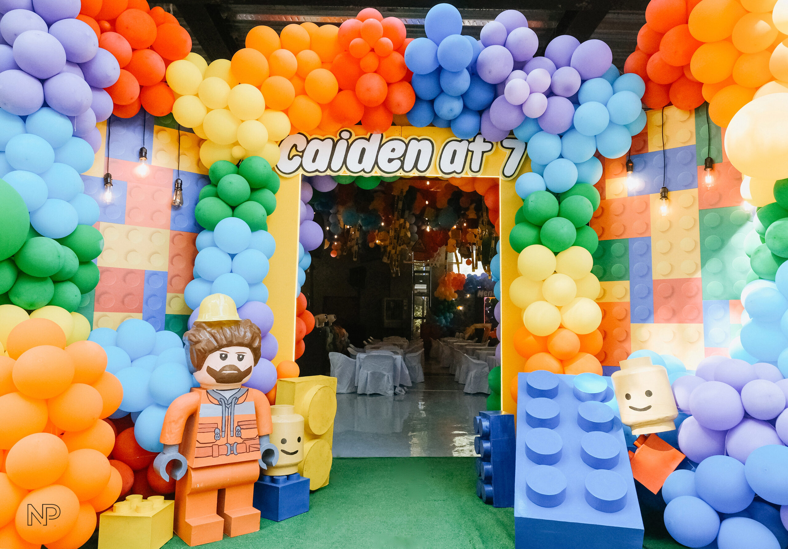 Creative Lego-themed party setup in the Philippines with colorful brick decorations, balloon arches, and character displays