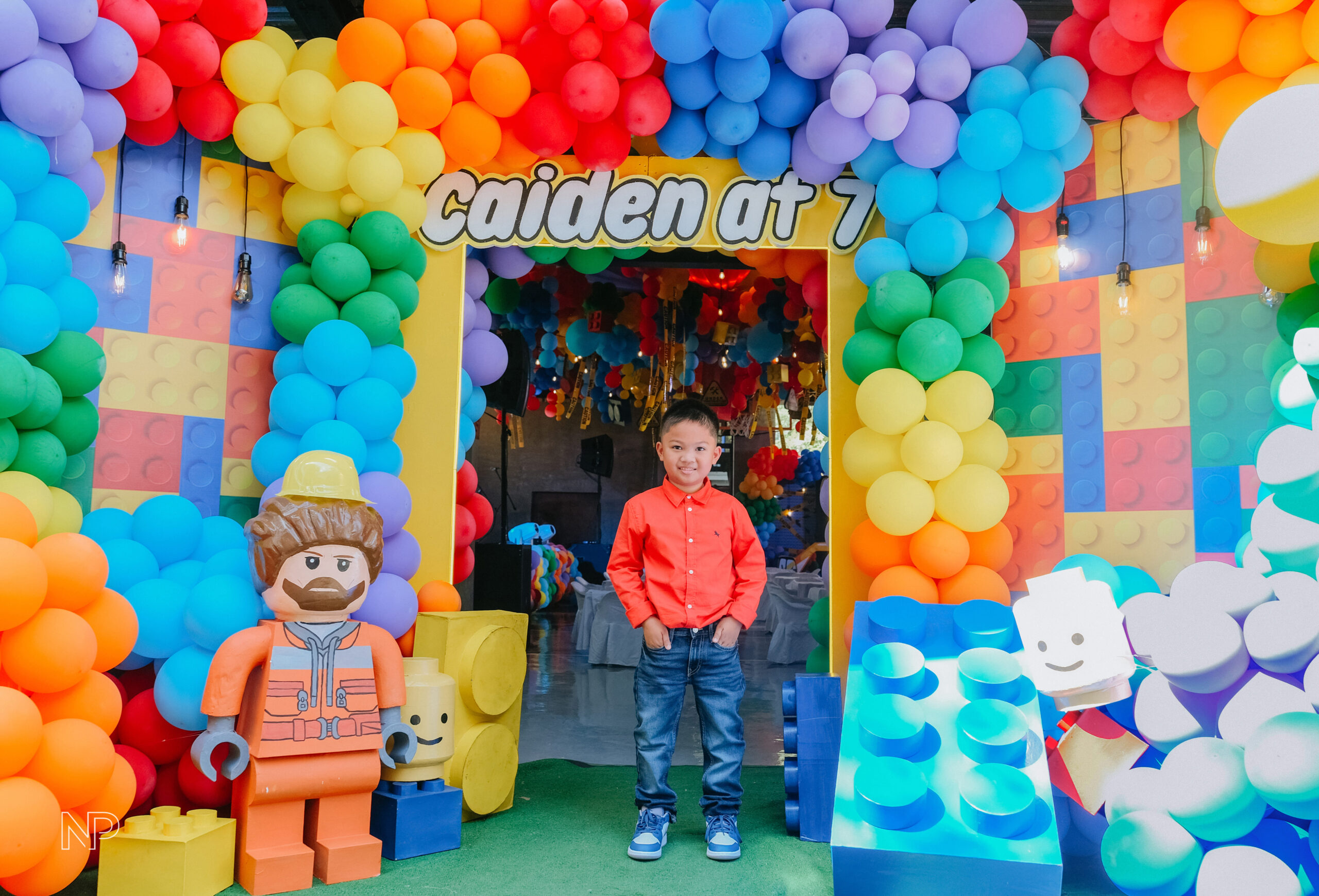 Creative Lego-themed party setup in the Philippines with colorful brick decorations, balloon arches, and character displays