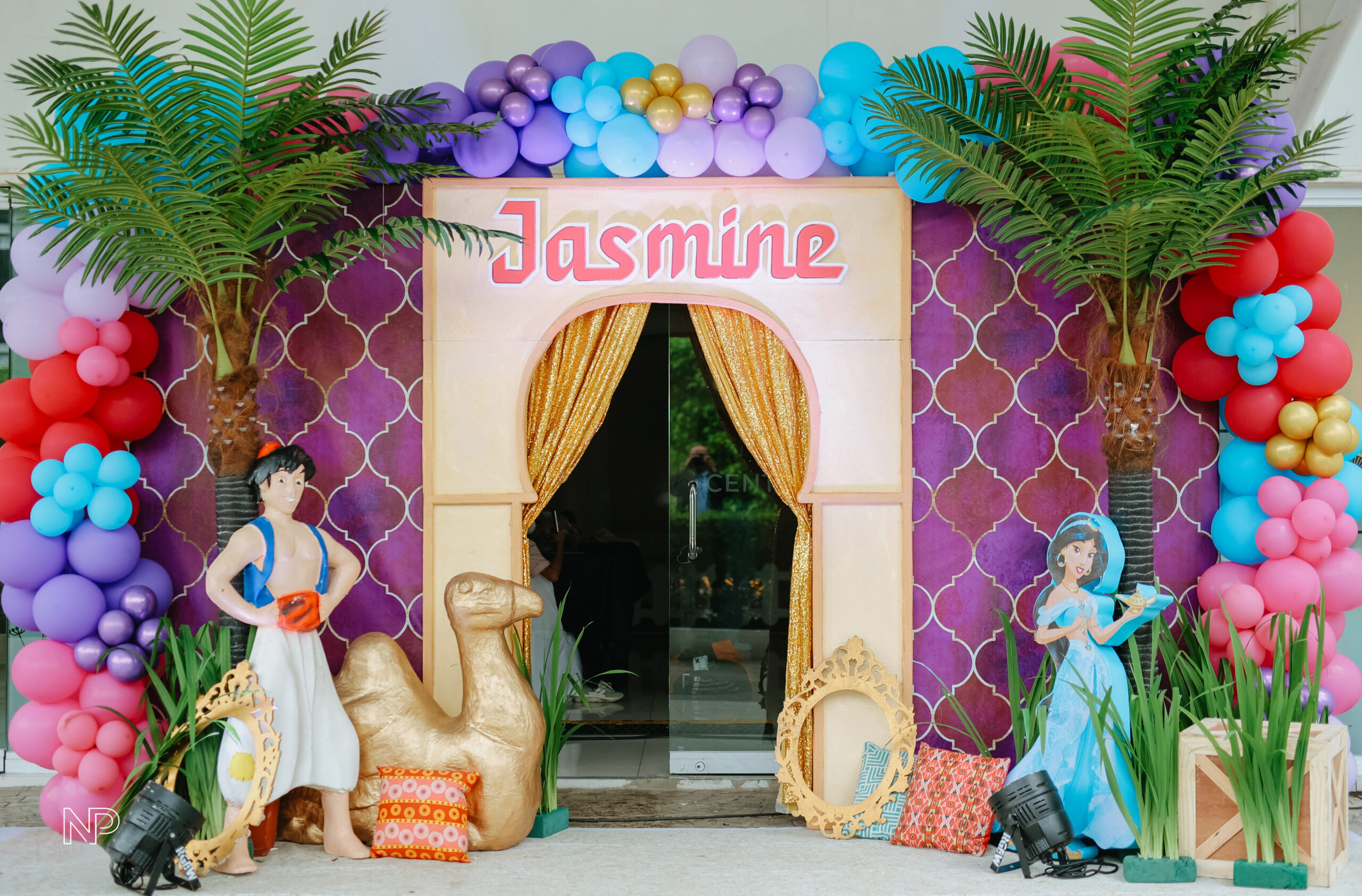 Aladdin themed event decor with magical Arabian Nights ambiance, vibrant colors, and intricate details. Event styling featuring Genie-inspired elements, lanterns, and Middle Eastern-inspired designs. Perfect for birthday parties, themed events, and fairytale celebrations