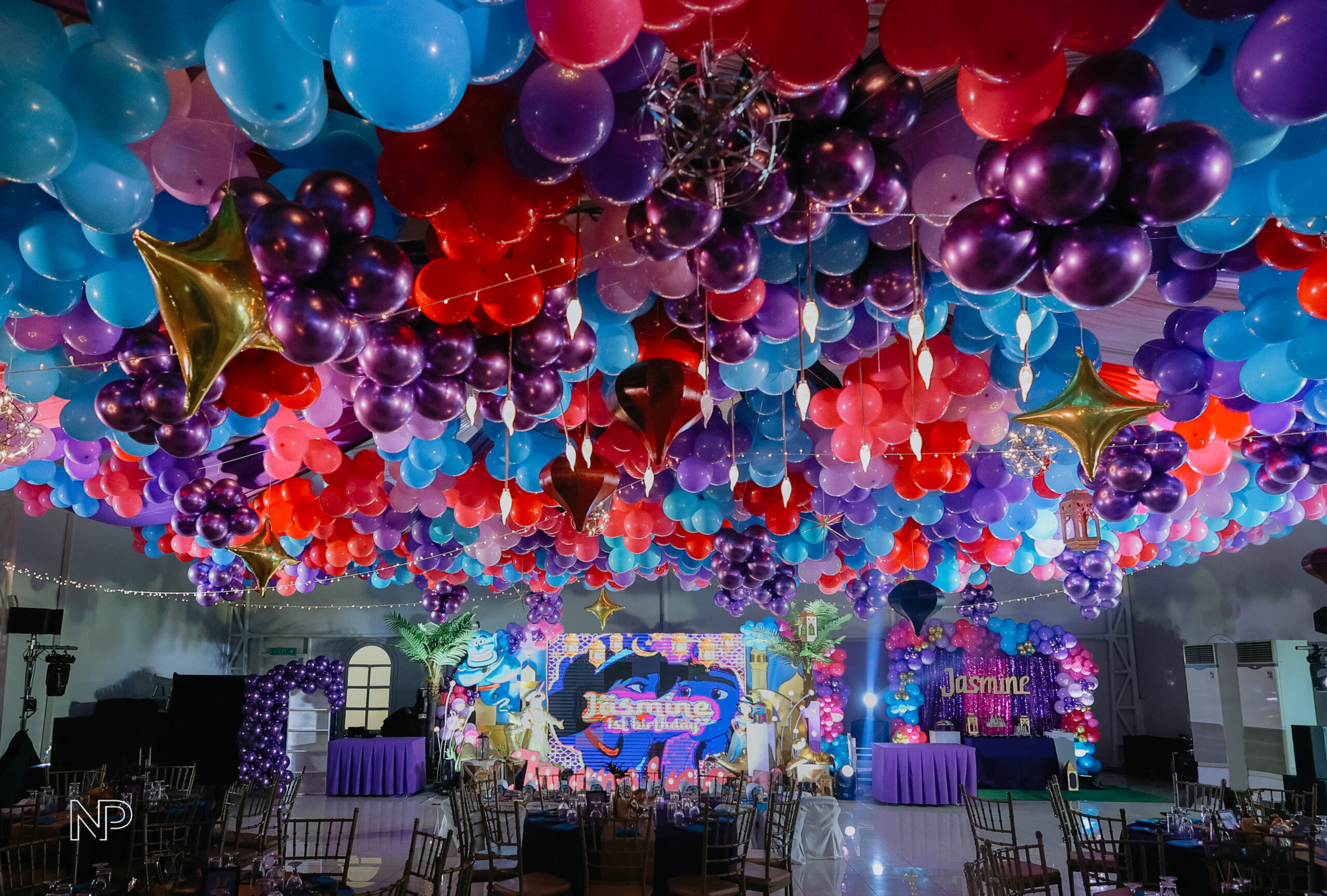 Aladdin themed event decor with magical Arabian Nights ambiance, vibrant colors, and intricate details. Event styling featuring Genie-inspired elements, lanterns, and Middle Eastern-inspired designs. Perfect for birthday parties, themed events, and fairytale celebrations