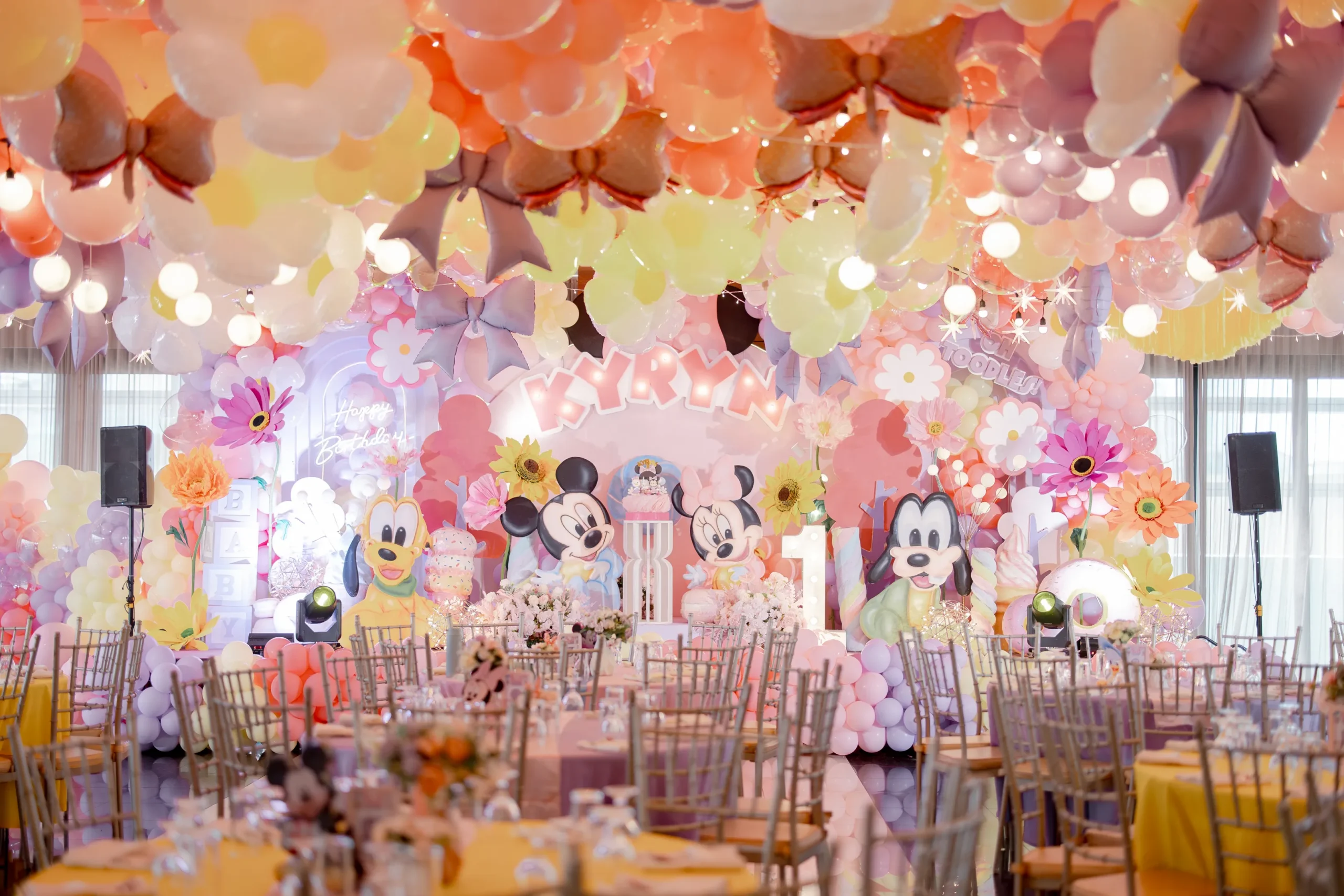 Minnie Mouse themed 1st birthday party for Kyryn with pastel pink, lavender and yellow balloon decorations