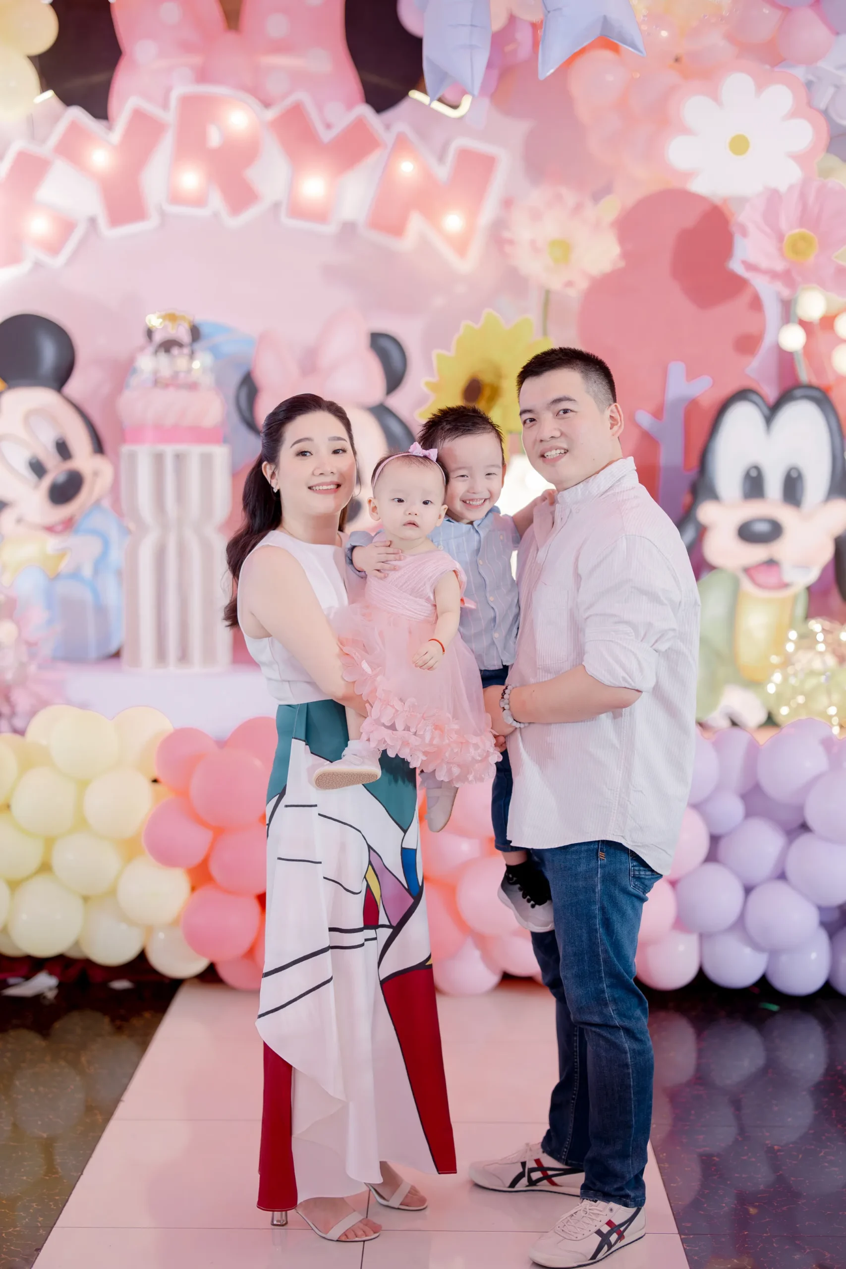 Minnie Mouse themed 1st birthday party for Kyryn with pastel pink, lavender and yellow balloon decorations