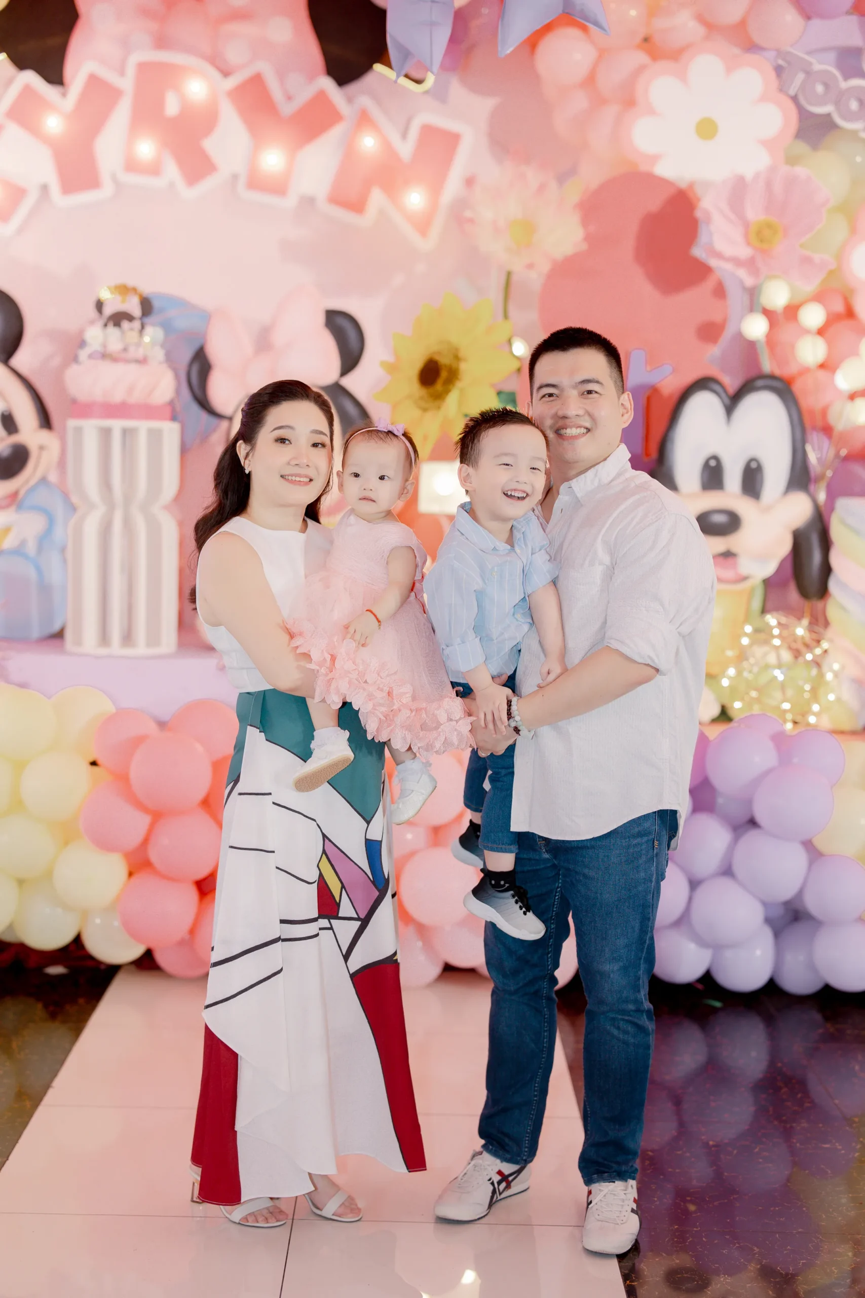 Minnie Mouse themed 1st birthday party for Kyryn with pastel pink, lavender and yellow balloon decorations