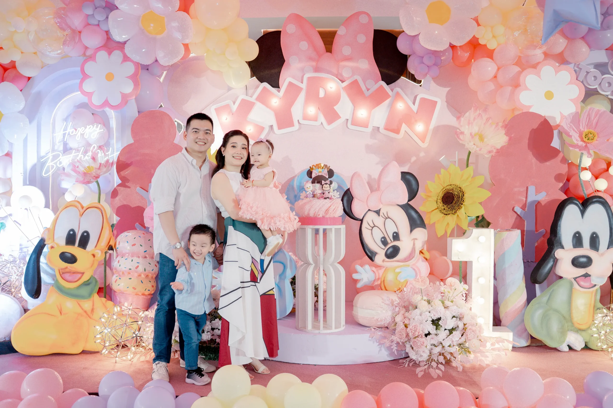 Minnie Mouse themed 1st birthday party for Kyryn with pastel pink, lavender and yellow balloon decorations