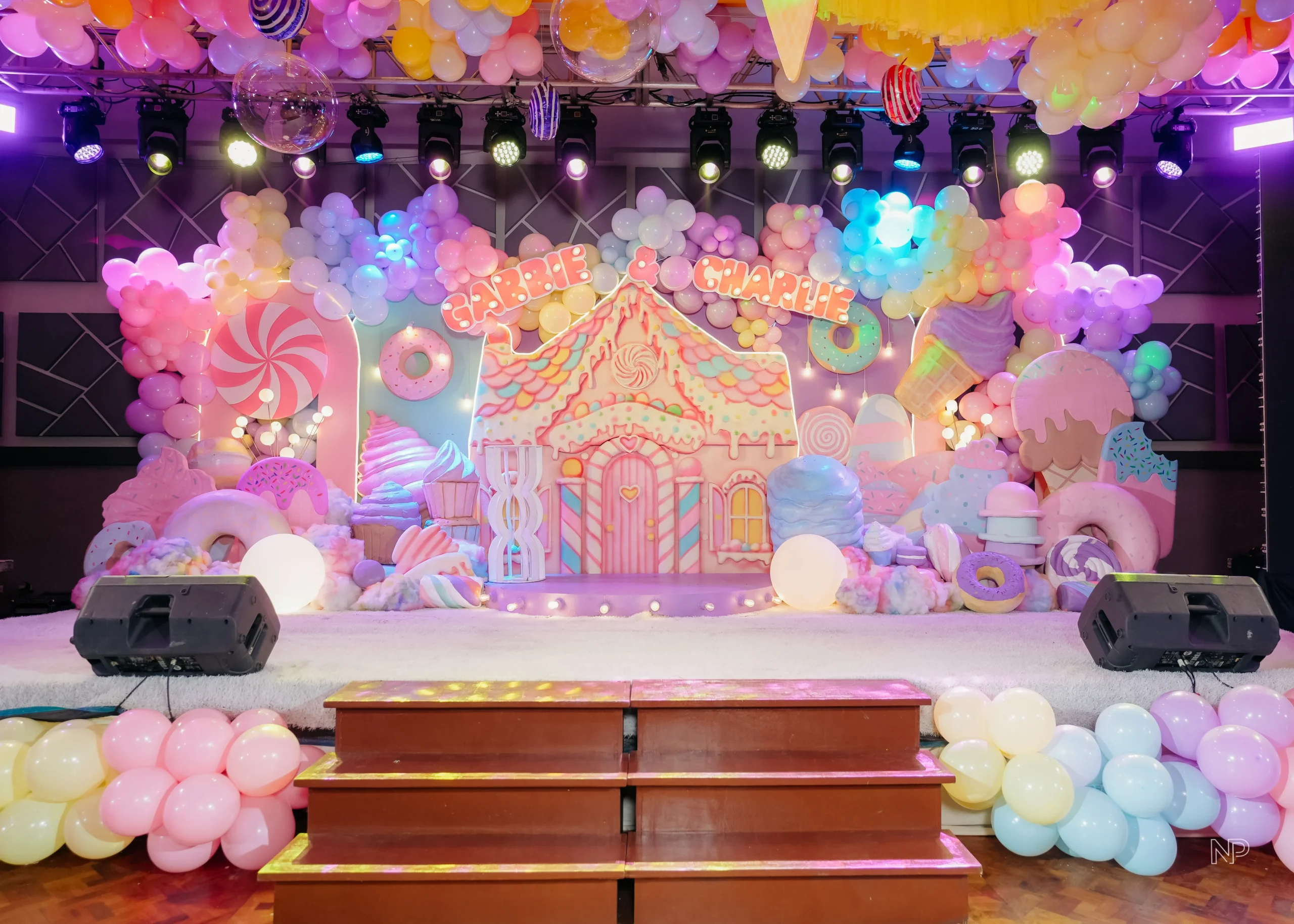 Pastel candy themed birthday party with donuts, lollipops and ice cream decorations