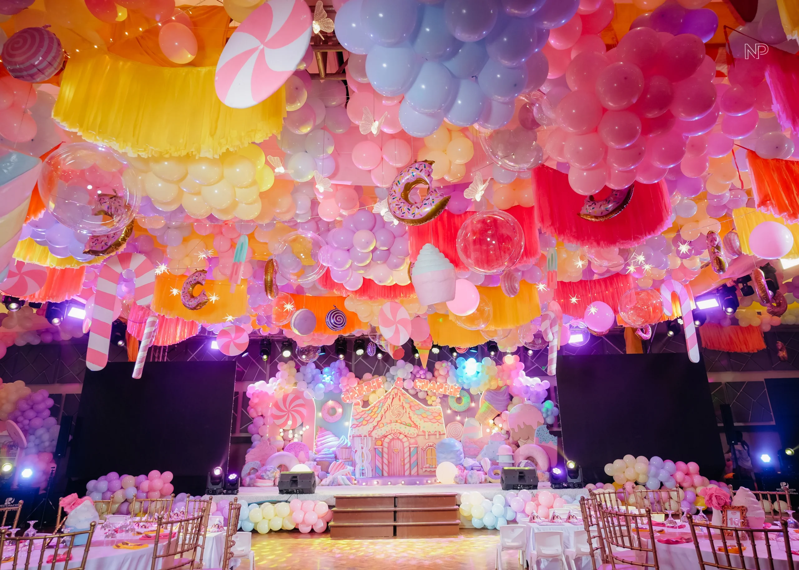 Pastel candy themed birthday party with donuts, lollipops and ice cream decorations