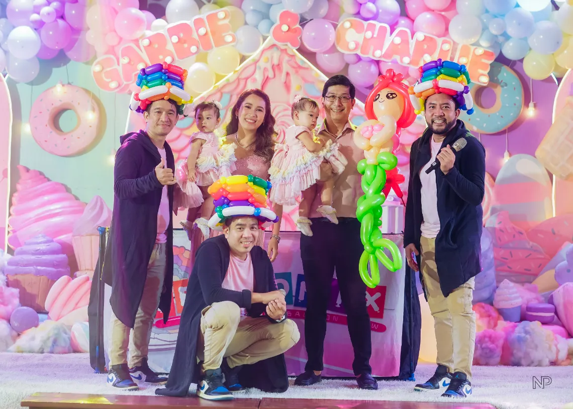 Kids Candyland birthday party with colorful balloons and sweet shoppe styling