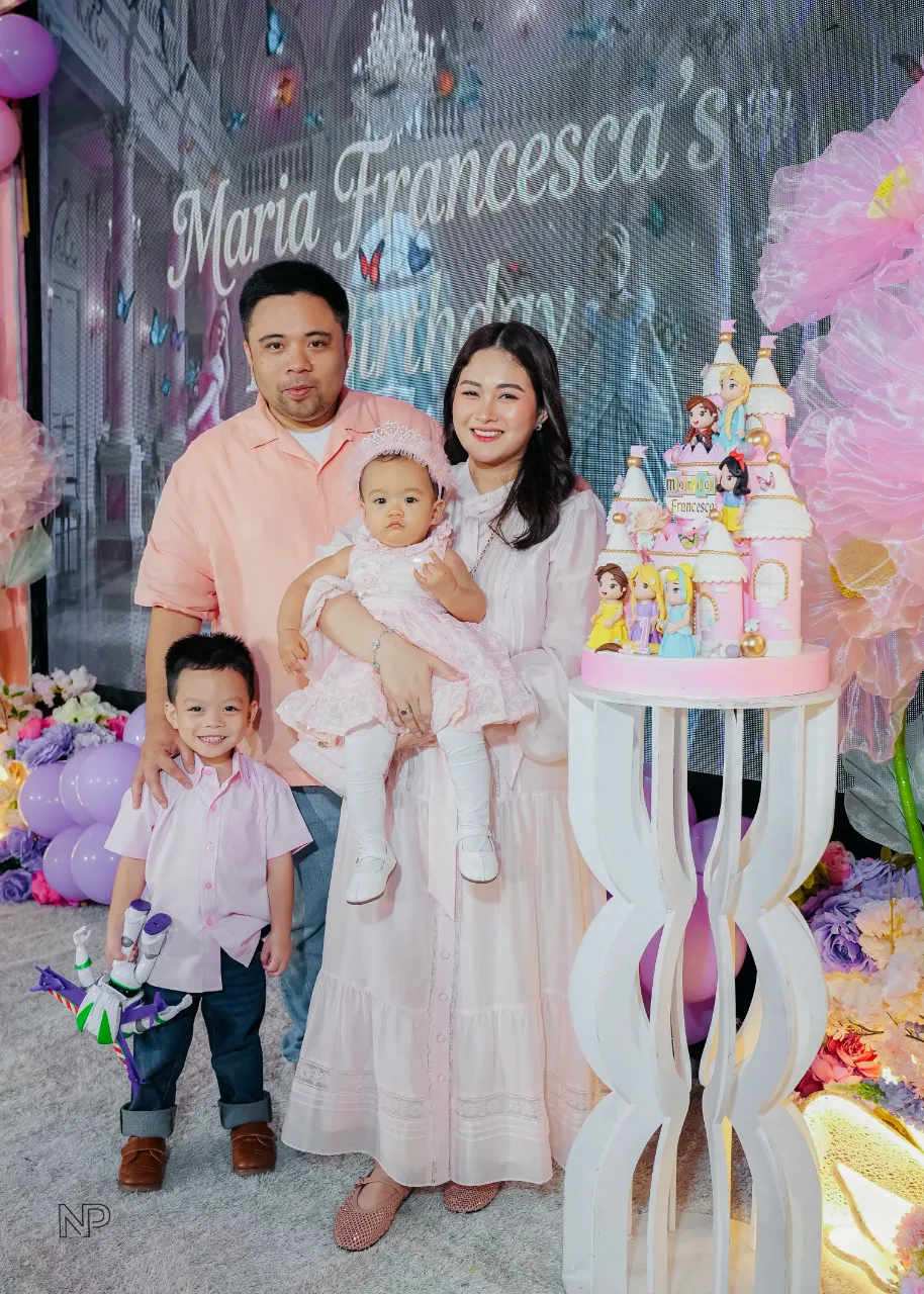 Princess birthday celebration with castle backdrop and pastel balloon decor