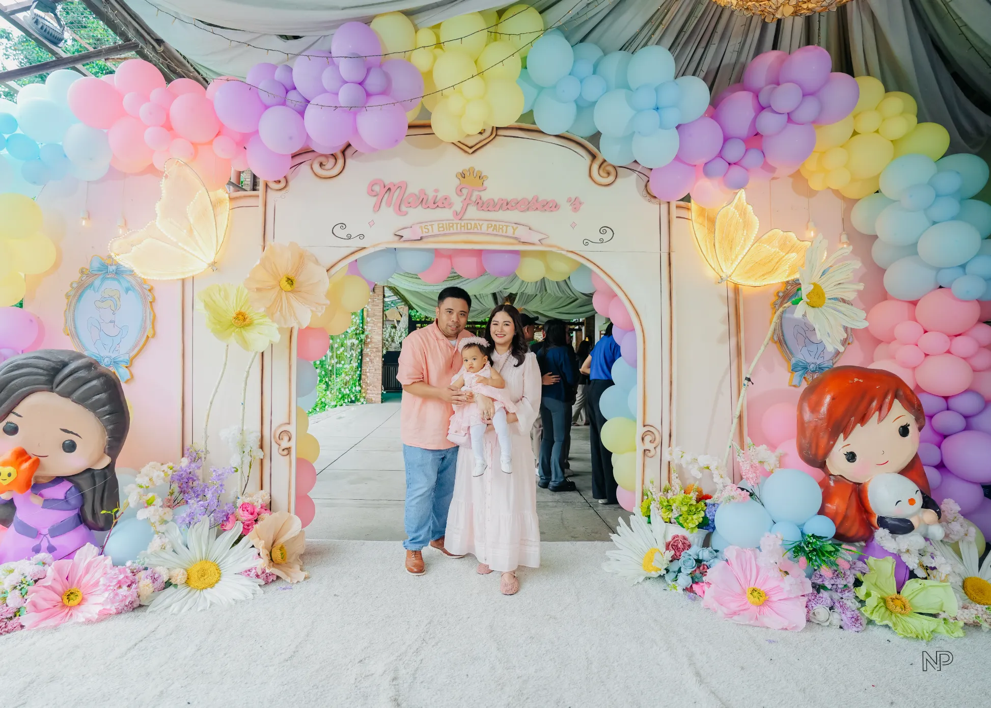 Pink princess castle birthday party with balloons, flowers and fairytale decorations