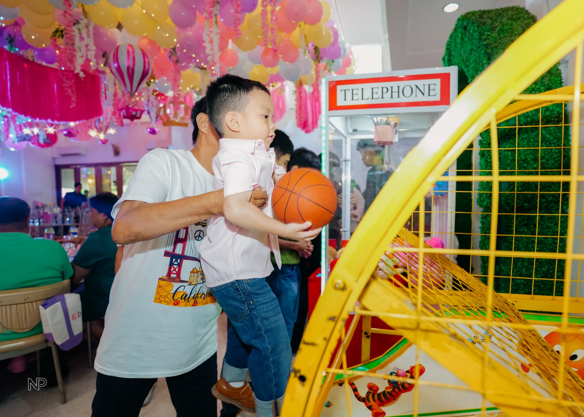 Pink princess castle birthday party with balloons, flowers and fairytale decorations