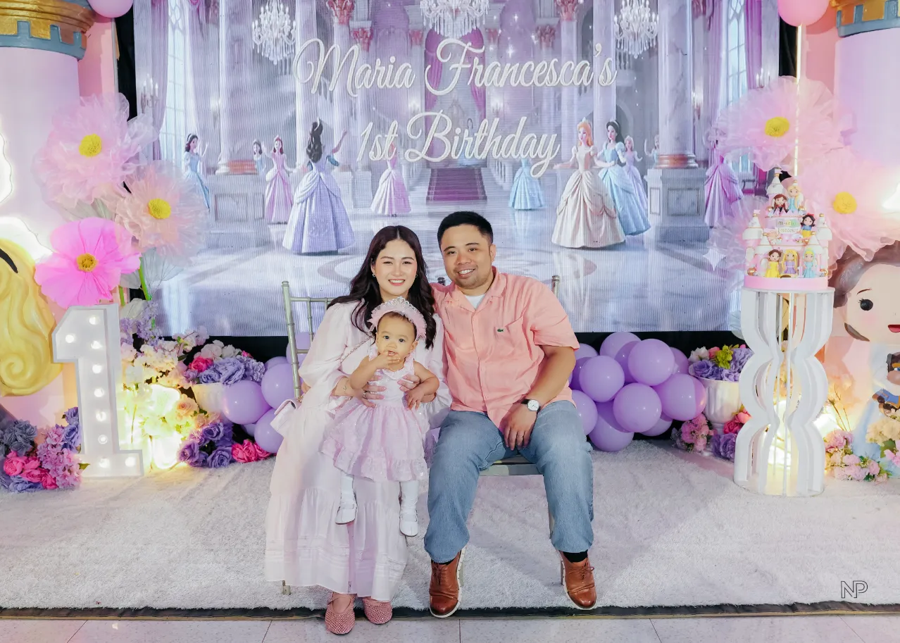 Princess birthday celebration with castle backdrop and pastel balloon decor