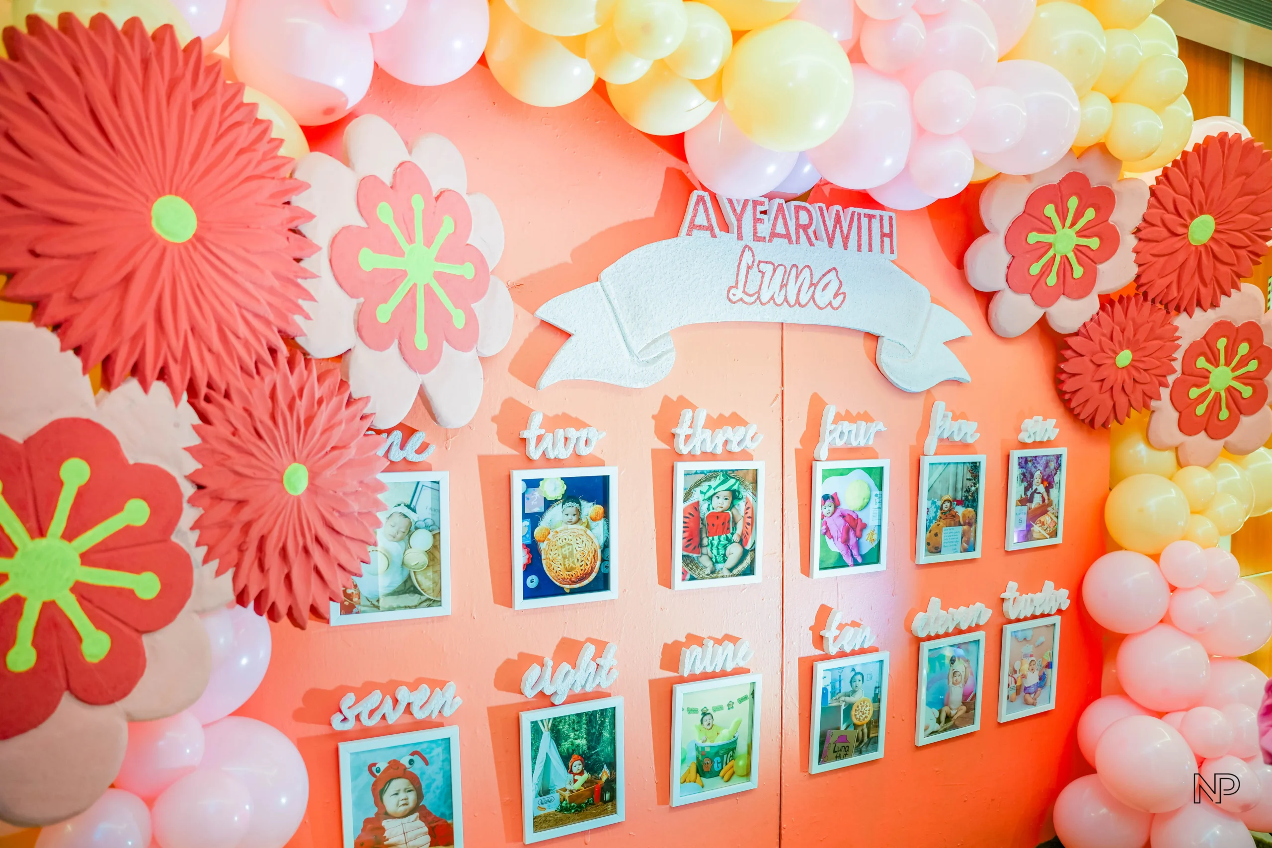 Chinese inspired birthday setup with pink lanterns, cherry blossoms and rabbits